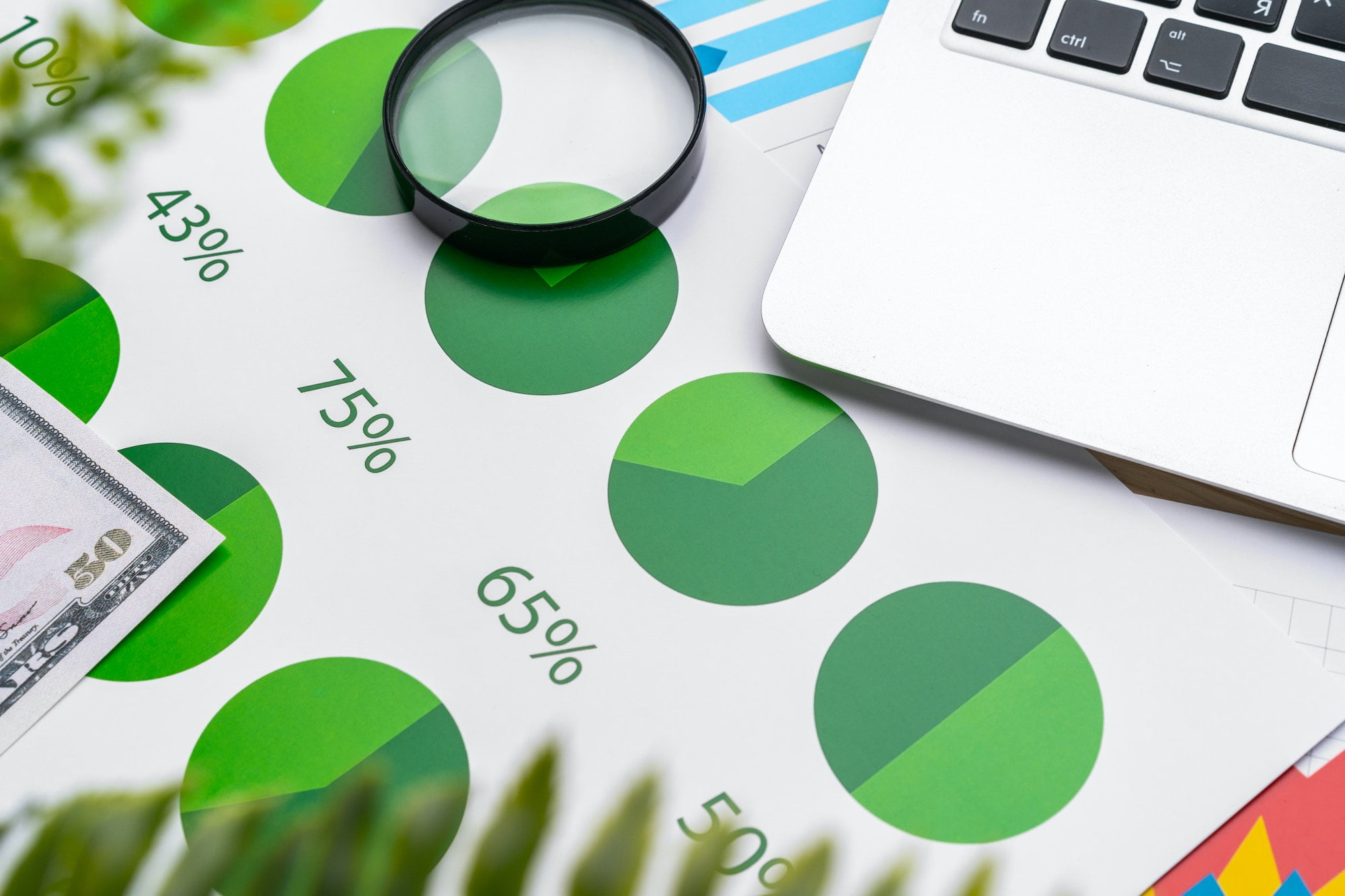 Financial report and laptop on business desk